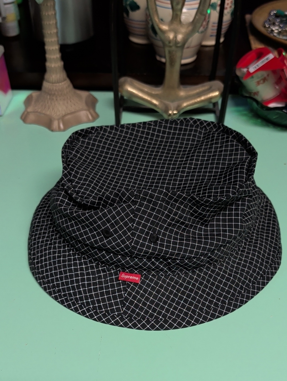 Supreme Black Grid Bucket Hat with Red Tag